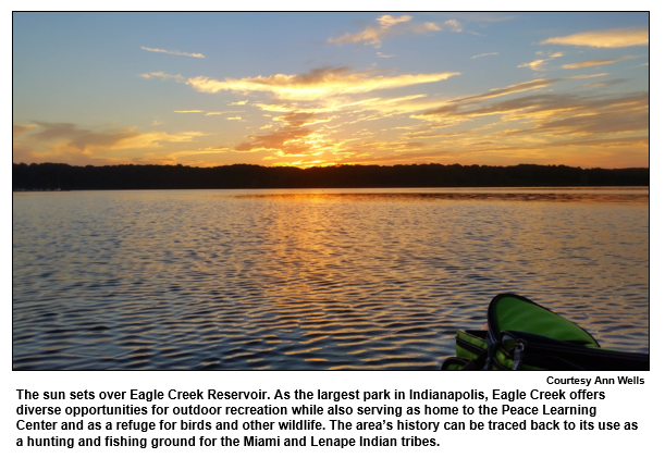 The sun sets over Eagle Creek Reservoir. As the largest park in Indianapolis, Eagle Creek offers diverse opportunities for outdoor recreation while also serving as home to the Peace Learning Center and as a refuge for birds and other wildlife. The area’s history can be traced back to its use as a hunting and fishing ground for the Miami and Lenape Indian tribes.  
Courtesy Ann Wells.