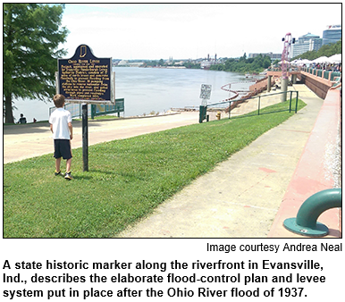A boy looks at a state historic marker along the riverfront in Evansville, Indiana. The marker describes the elaborate flood-control plan and levee system putin place after the Ohio River flood of 1937. Image courtesy Andrea Neal.