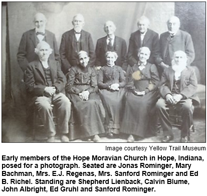 Early members of the Hope Moravian Church in Hope, Indiana, posed for a photograph. Seated are Jonas Rominger, Mary Bachman, Mrs. E.J. Regenas, Mrs. Sanford Rominger and Ed B. Richel. Standing are Shepherd Lienback, Calvin Blume, John Albright, Ed Gruhl and Sanford Rominger. Image courtesy Yellow Trail Museum.