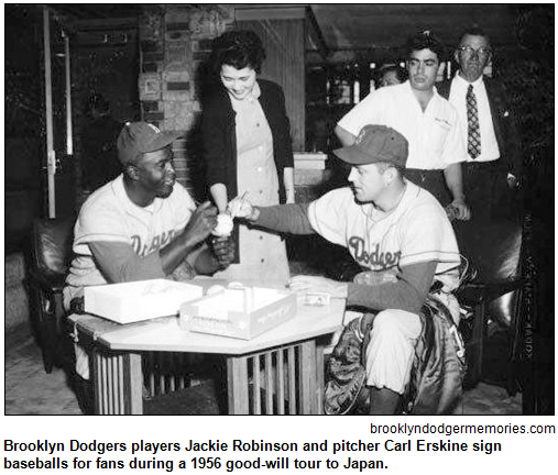 Brooklyn Dodgers players Jackie Robinson and pitcher Carl Erskine sign baseballs for fans during a 1956 good-will tour to Japan. Image courtesy brooklyndodgermemories.com