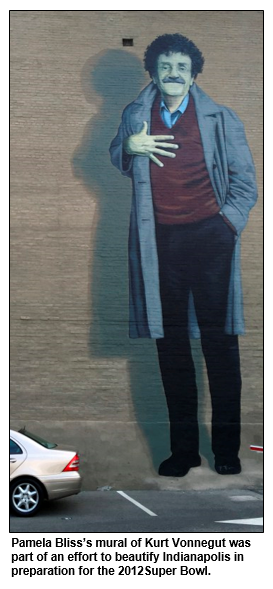 Mural by Pamela Bliss depicts Kurt Vonnegut. It is several stories tall on the side of a Massachusetts Avenue building.