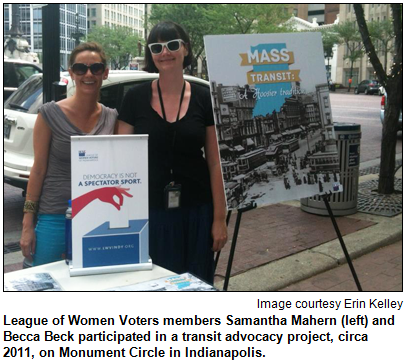 League of Women Voters members Samantha Mahern (left) and Becca Beck participated in a transit advocacy project, circa 2011, on Monument Circle in Indianapolis. Image courtesy Erin Kelley.
