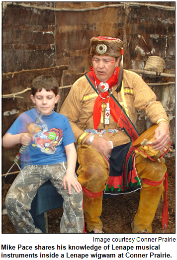 Mike Pace shares his knowledge of Lenape musical instruments inside a Lenape wigwam at Conner Prairie. Image courtesy Conner Prairie.