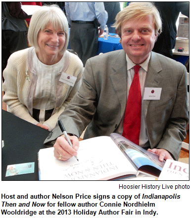 Host and author Nelson Price signs a copy of Indianapolis Then and Now for fellow author Connie Nordhielm Wooldridge at the 2013 Holiday Author Fair in Indy. Hoosier History Live photo.