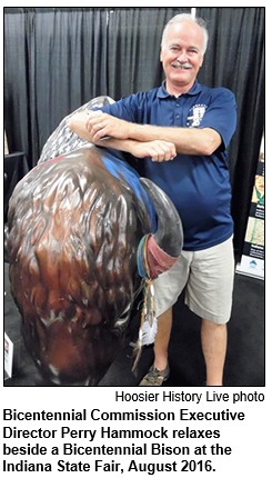 Bicentennial Commission Executive Director Perry Hammock relaxes beside a Bicentennial Bison at the Indiana State Fair, August 2016.
Hoosier History Live photo.