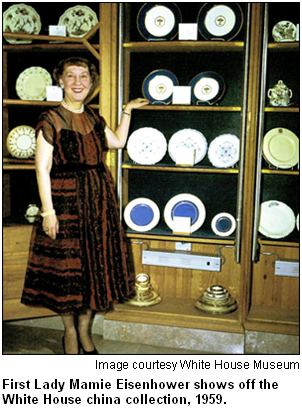 First Lady Mamie Eisenhower shows off the White House china collection, 1959. Image courtesy White House Museum.